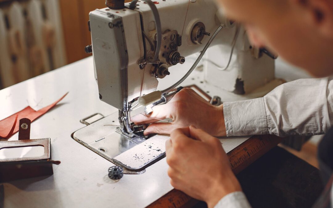 Man in a studio creates leather ware